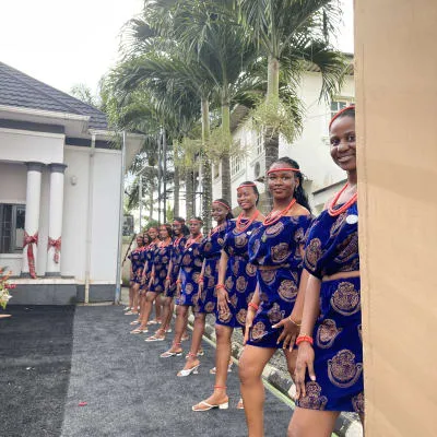 Long lineup of ushers in blue Ankara attire
